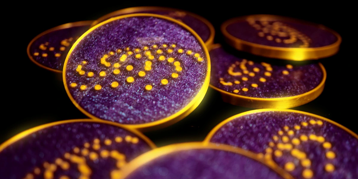 Close-up of purple and gold Cryptatrope Adventure completion tokens